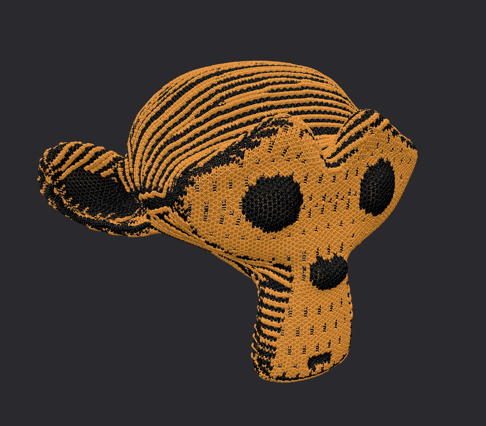 A monkey head knitted in orange and black — engineered and produced with LOOP.